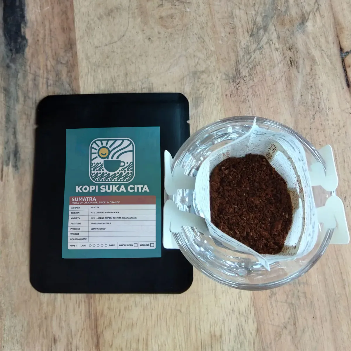 Ground coffee from a Kopi Suka Cita single-brew drip bag ready for pour-over